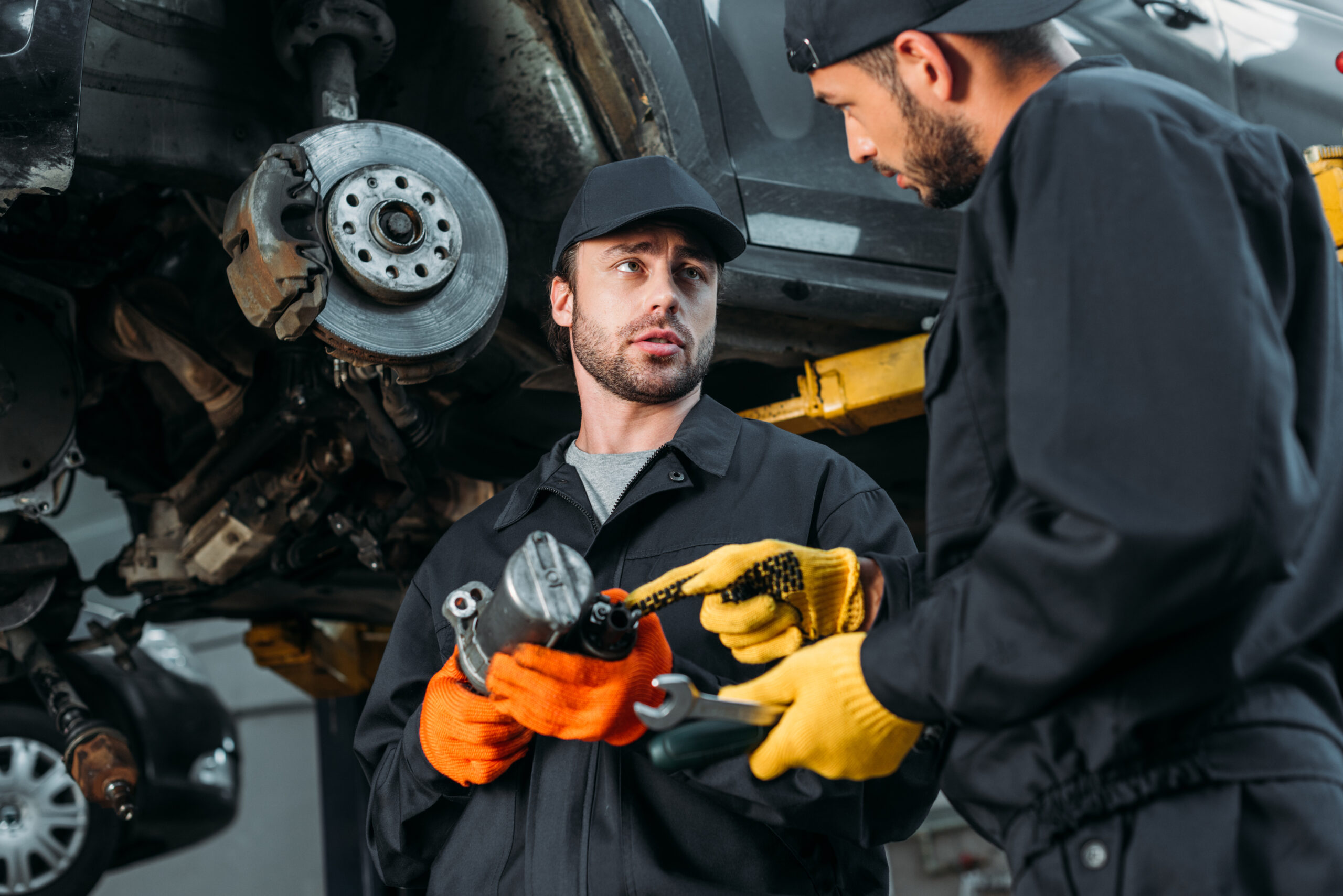 How to Choose the Right Mechanic Auto mechanics working with car and tools in workshop Bountiful UT