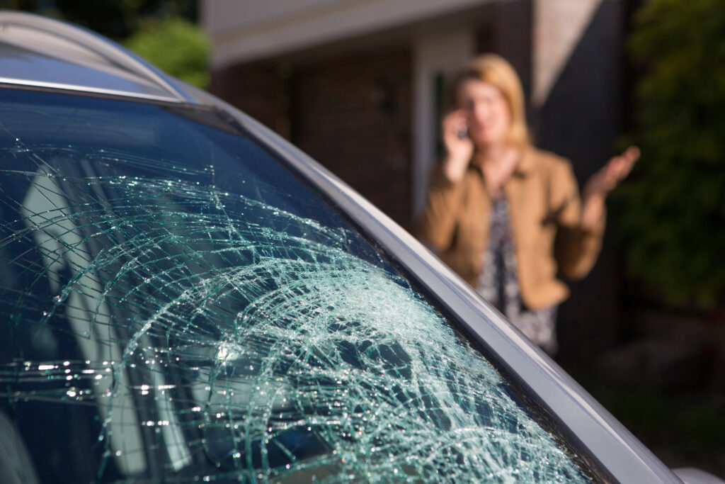 The 3 Major Risk Factors To Crack A Windshield Woman Phoning For Help After Car Windshield Has Broken. Crack a Windshield